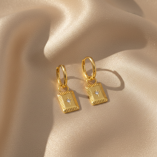 Gold star charm hoop earrings on silk